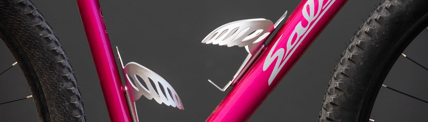 Two PDW bottle cages mounted on a bike frame.