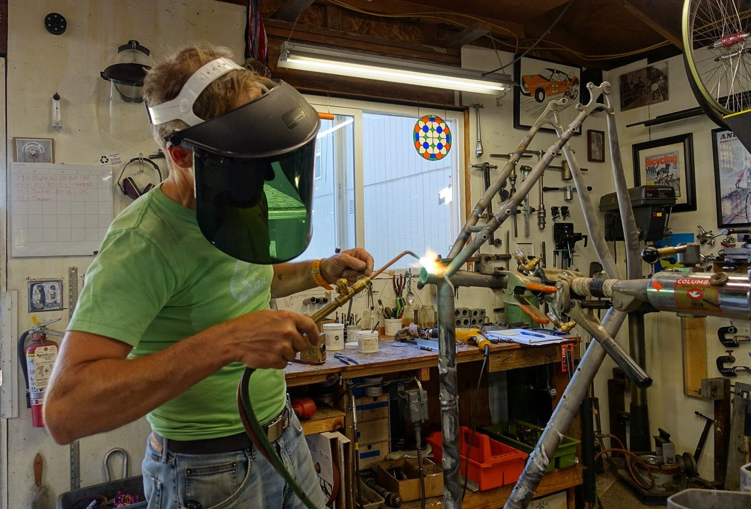 Ira Ryan welding on a bicycle frame
