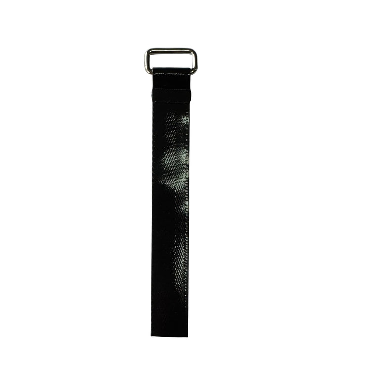 Black textured fender strap with a metal d-ring on a white background.