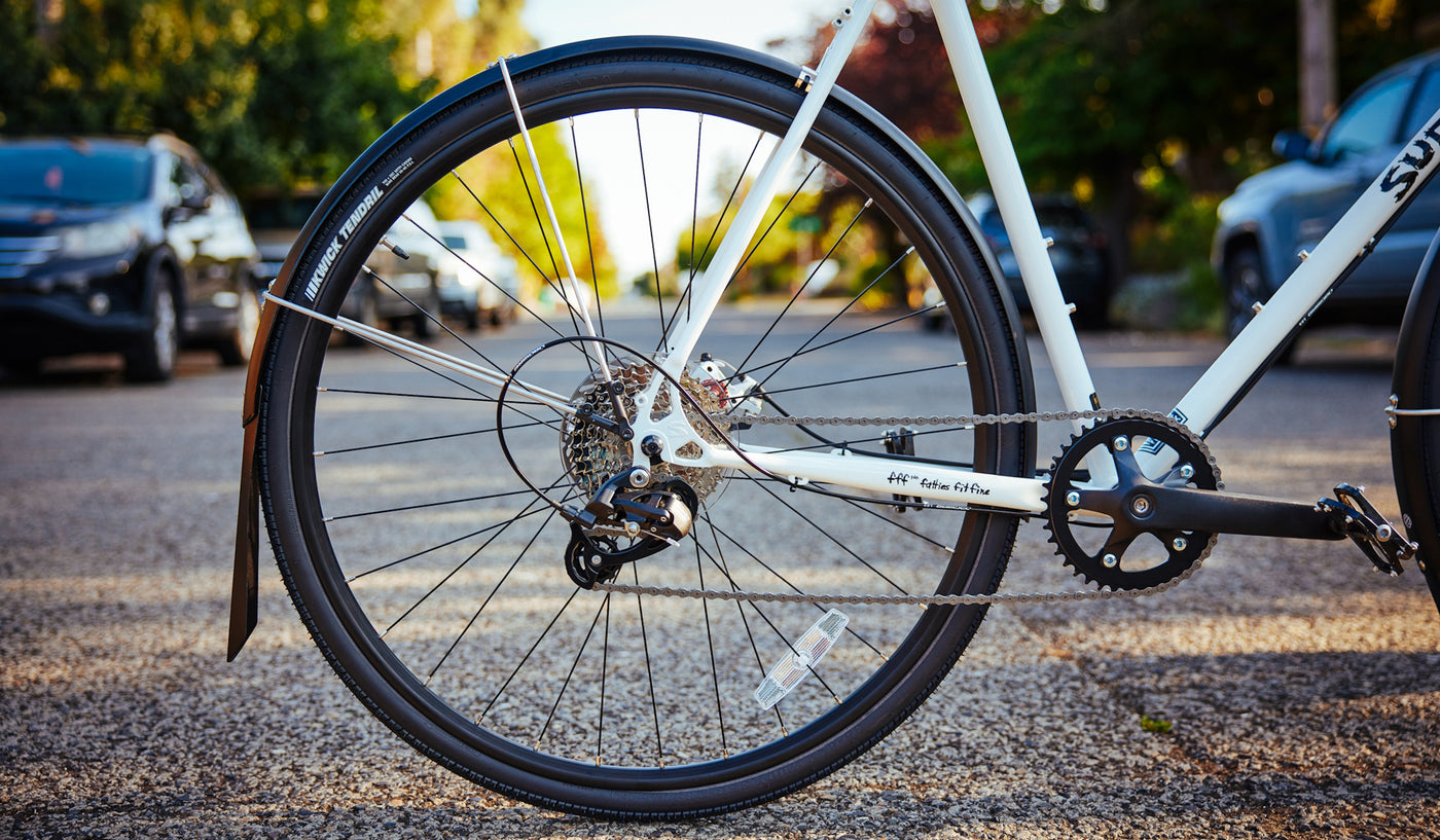 Rear full coverage fender mounted on a road bike
