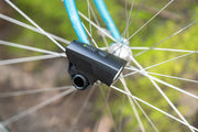 The PDW Light Nug mounted to the front hub on a bike.