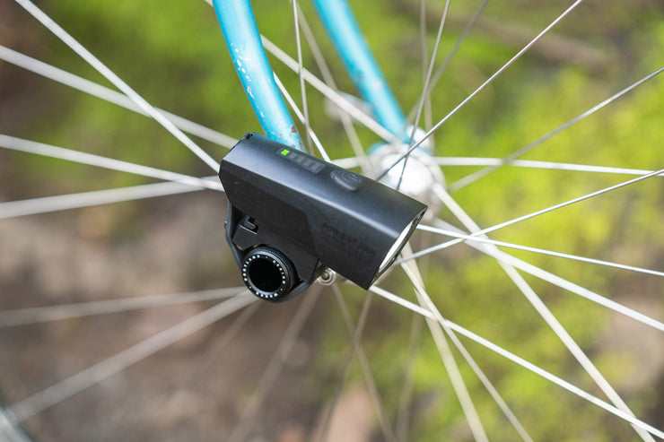 The PDW Light Nug mounted to the front hub on a bike.